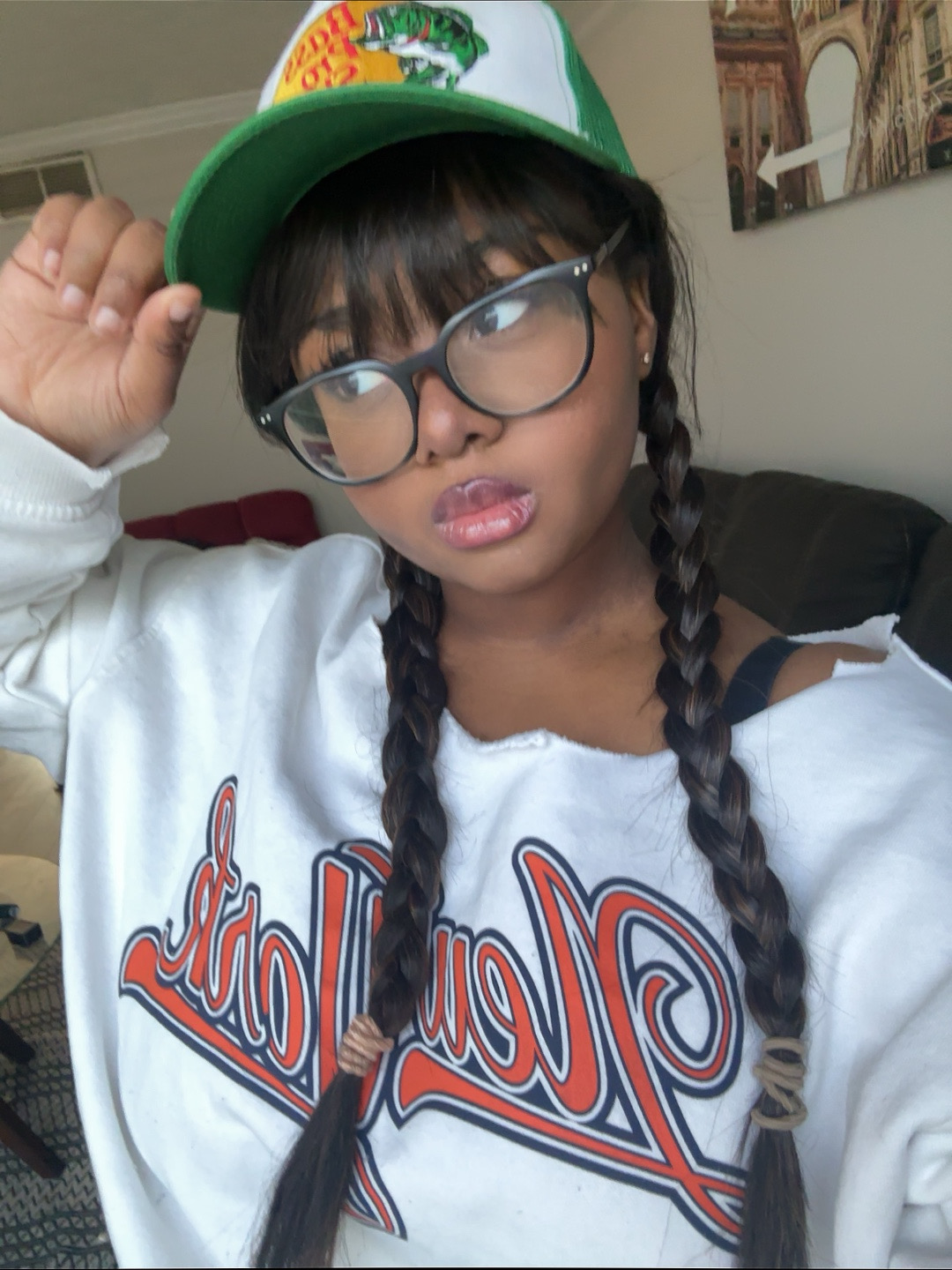 Lana in glasses and a baseball cap