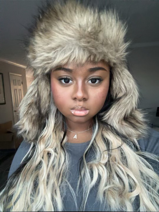 Lana wearing a fur-style hat