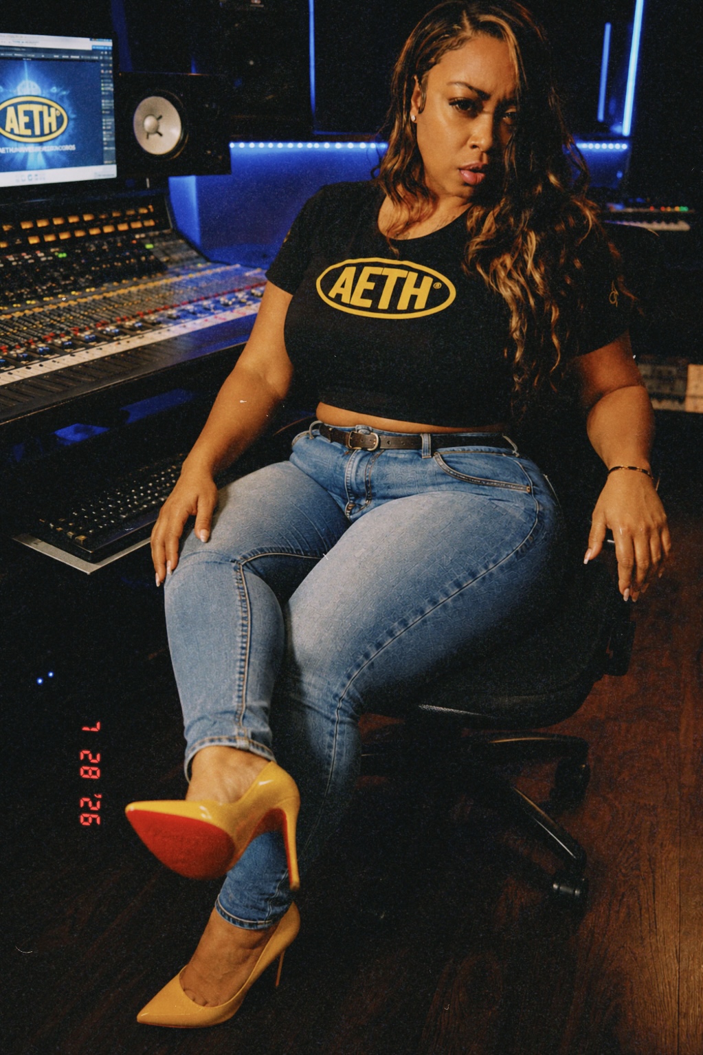Ms. Williams seated at a recording studio console