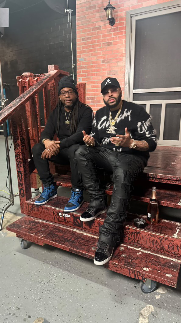 Two guests sitting on outdoor steps